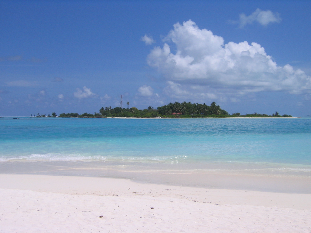 Dhiffushi Island seen across the lagoon from neighboring Meeru Island, North Malé Atoll, Maldives