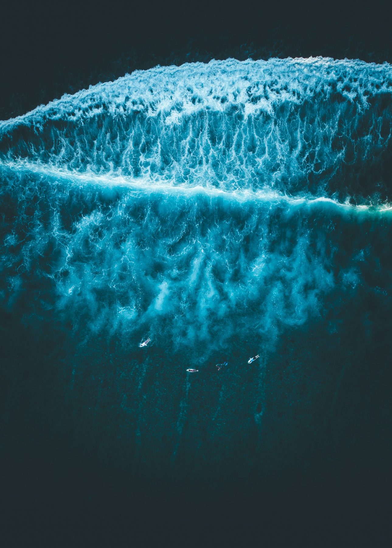 Aerial view of ocean waves off Thulusdhoo, Maldives, near the island's Cokes surf break